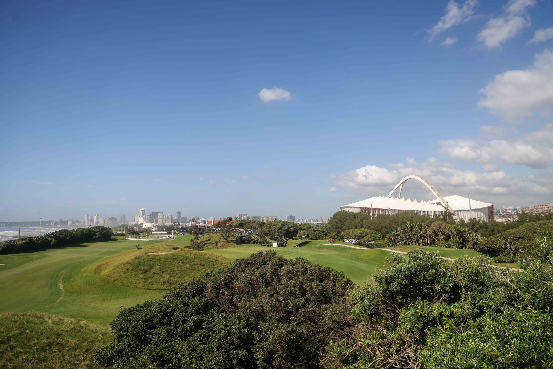 The Durban Country Club coast, with the city skyline and stadium arch in the distance